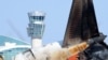 This picture shows the control tower and the Jeju Air Boeing 737-800 aircraft which crashed and burst into flames at Muan International Airport in Muan, some 288 kilometers southwest of Seoul on Jan. 2, 2025.