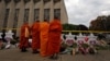 Monks pay their respects at a makeshift memorial outside the Tree of Life synagogue following Saturday's shooting at the synagogue in Pittsburgh, Penn., Oct. 29, 2018. 