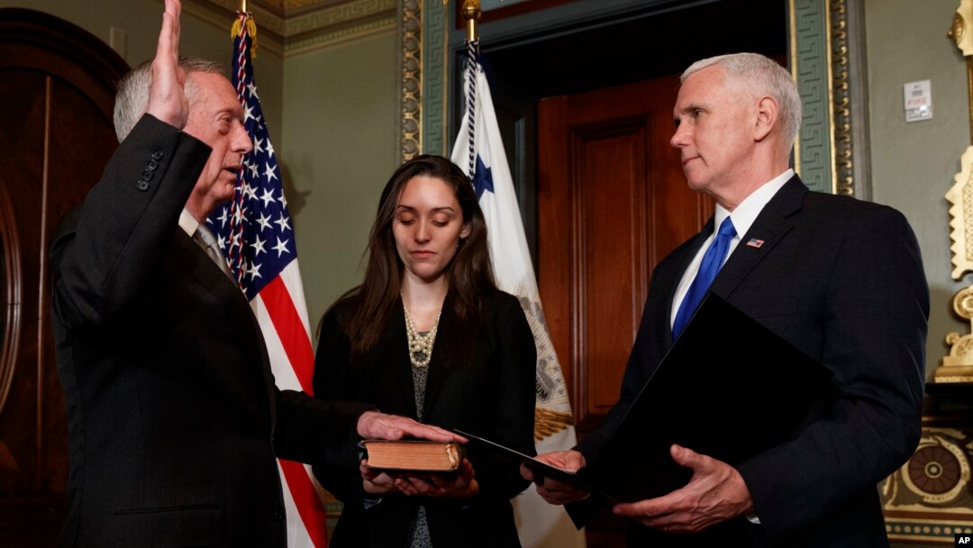 Vice President Mike Pence administers the oath of office the Defense Secretary James Mattis, Jan. 20, 2017, in the Vice Presidential Ceremonial Office in the Eisenhower Executive Office building on the White House grounds in Washington. 
