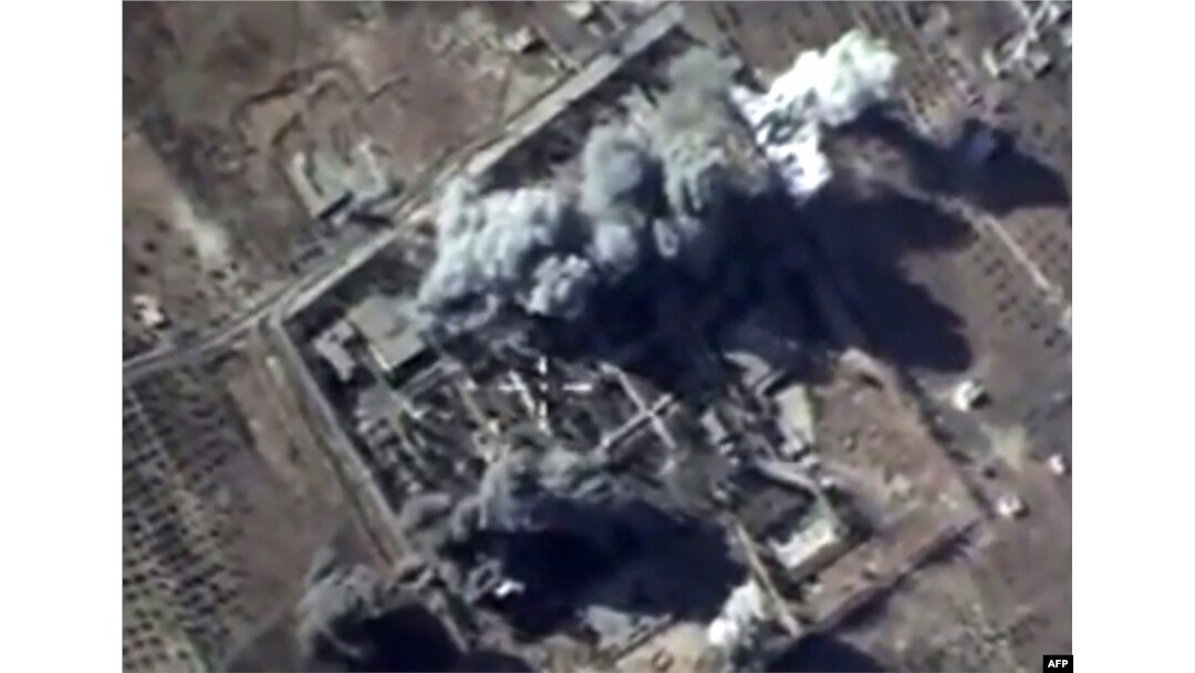 A video grab made on October 12, 2015, shows an image taken from a footage made available on the Russian Defence Ministry's official website, purporting to show explosions after airstrikes carried out by Russian air force on what Russia says was an Islami