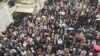 Hundreds of Iranian supporters of Iran's national trade union rally outside its Workers' House building in Tehran, May 1, 2018. 