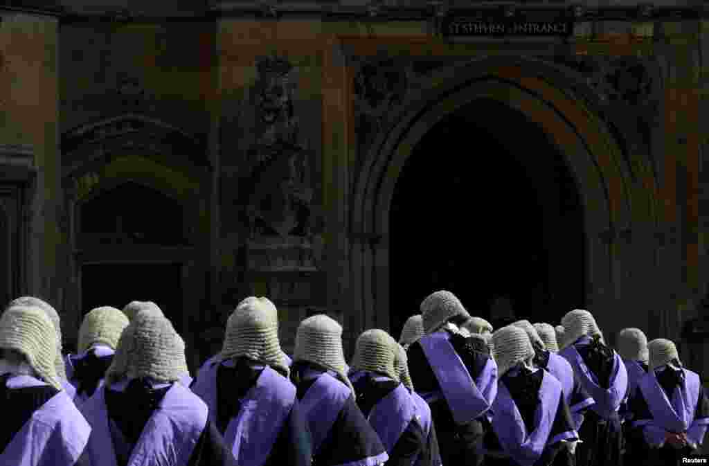 Members of the legal profession cross from Westminster Abbey to the Houses of Parliament, following the annual Judges' Service in London, Britain.