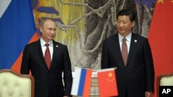 Rossiya prezidenti Vladimir Putin va Xitoy rahbari Si Zinpin Shanxayda, 21-may, 2014 