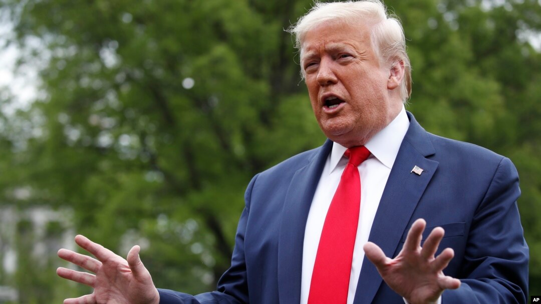 President Donald Trump speaks with reporters on the South Lawn of the White House as he departs on Marine One, May 14, 2020, in Washington. 