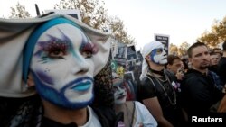 Members and supporters of the lesbian, gay, bisexual and transgender (LGBT) community protest against discrimination and violence, at the Place de la Republique in Paris, France, Oct. 21, 2018. 