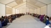 Afghan refugees eat lunch at a registration center upon their arrival from Pakistan at the Afghanistan-Pakistan border in Spin Boldak district of Kandahar province on Dec. 3, 2023.
