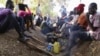 Civilians rest inside the United Nations compound on the outskirts of the capital Juba in South Sudan, Dec. 17, 2013. 