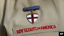 A photo shows a close-up detail of a Boy Scout uniform worn by a scout during a news conference at the Boy Scouts of America headquarters in Irving, Texas, Feb. 4, 2013. 