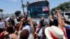 Demonstrators block a bus with immigrant children aboard during a protest outside the U.S. Border Patrol Central Processing Center, June 23, 2018, in McAllen, Texas. Extra law enforcement officials were called in to help control the scene and allow the bus to move.