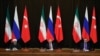 FILE - Turkey's President Recep Tayyip Erdogan, right, Russia's President Vladimir Putin, center, and Iran's President Hassan Rouhani are seen at a news conference following their talks on Syria, in Russia's Black Sea resort of Sochi, Russia, Nov. 22, 2017. The three will be meeting in Ankara, Turkey, Wednesday.