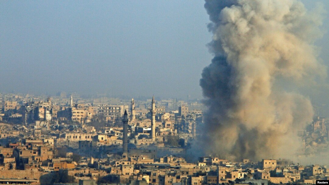 Smoke rises as seen from a rebel-held area of Aleppo, Syria, Dec. 12, 2016. 