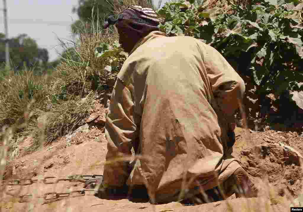 South African authorities said 22 gold miners who came out of a disused and temporarily blocked shaft,&nbsp;near Johannesburg over the last two days have been arrested and will be charged with illegal mining, Feb. 17, 2014.