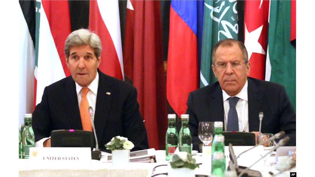 U.S. Secretary of State John Kerry, left, and Russian Foreign Minister Sergey Lavrov confer in Vienna, Austria, Nov. 14, 2015. Foreign ministers from more than a dozen nations are meeting in Vienna seeking to find a way to resolve the conflict in Syria.