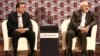 FILE -Iranian Foreign Minister Mohammad Javad Zarif (R) and deputy Foreign Minister for European and American Affairs Majid Takht-Ravanchi (L) listen during a meeting with journalists in Tehran.