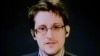 FILE - Edward Snowden delivers remarks via video link from Moscow to attendees at a discussion regarding an International Treaty on the Right to Privacy, Protection Against Improper Surveillance and Protection of Whistleblowers in Manhattan, New York, Sept. 24, 2015.