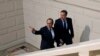 French President, Francois Hollande (l) and British Prime Minister David Cameron arrive for a press conference in Amiens, northern France, March 3, 2016.