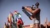 A statue of a cameraman stands at the Pan-African Film and Television Festival (FESPACO) headquarters in Ouagadougou, on Oct. 14, 2021.