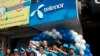  ရန်ကုန်မြို့Telenor အရောင်းပြခန်းတခု ဖွင့်လှစ်ခဲ့စဉ် (၂၆၊၁၁၊၂၀၁၄) (ဓာတ်ပုံ - AP) 