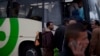 Palestinians laborers board a Palestinian-only bus on route to the West Bank after working in Tel Aviv, March 4, 2013.