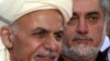 FILE - Afghanistan Chief Executive Abdullah Abdullah, right, listens as President Ashraf Ghani speaks at the presidential palace in Kabul, Oct. 4, 2014,
