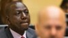FILE - Kenya's Deputy President William Ruto, left, accompanied by defense counsel Karim Khan, right, awaits the start of his trial.