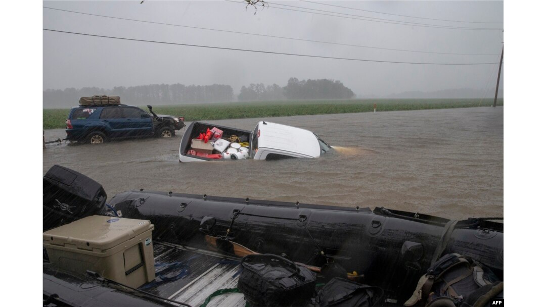 A pickup is submerged in floodwaters in Lumberton, N.C., Sept. 15, 2018, in the wake of Hurricane Florence.