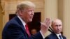 U.S. President Donald Trump speaks with Russian President Vladimir Putin during a press conference after their meeting at the Presidential Palace in Helsinki, Finland, July 16, 2018. 