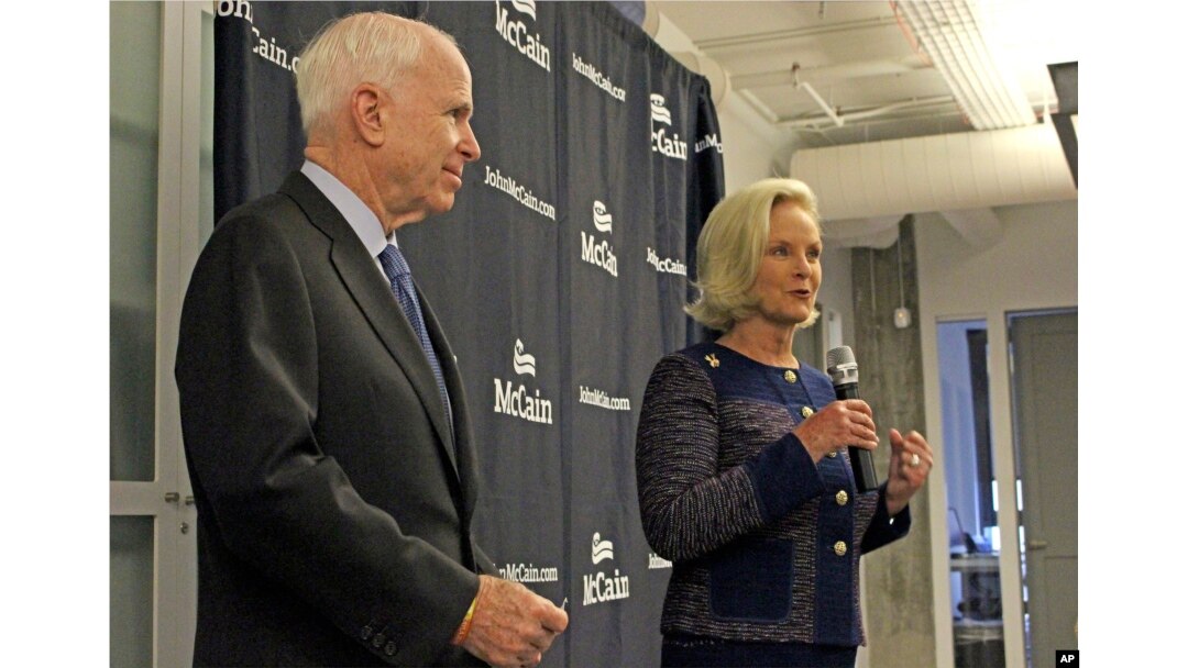 Cindy McCain, right, introduces her husband, Sen. John McCain, R-Ariz., to a group of female supporters in Scottsdale, Ariz., Oct. 12, 2016. Sen. McCain announced a new coalition of female supporters at the event, just days after concerns about comments presidential candidate Donald Trump made about women prompted him to pull his endorsement.