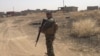 Under Fire, IS Leaves Behind Bombs, Tunnels and Qurans