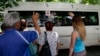 Relatives wave good-bye to children being evacuated from violence-ridden Slovyansk, eastern Ukraine, June 7, 2014.