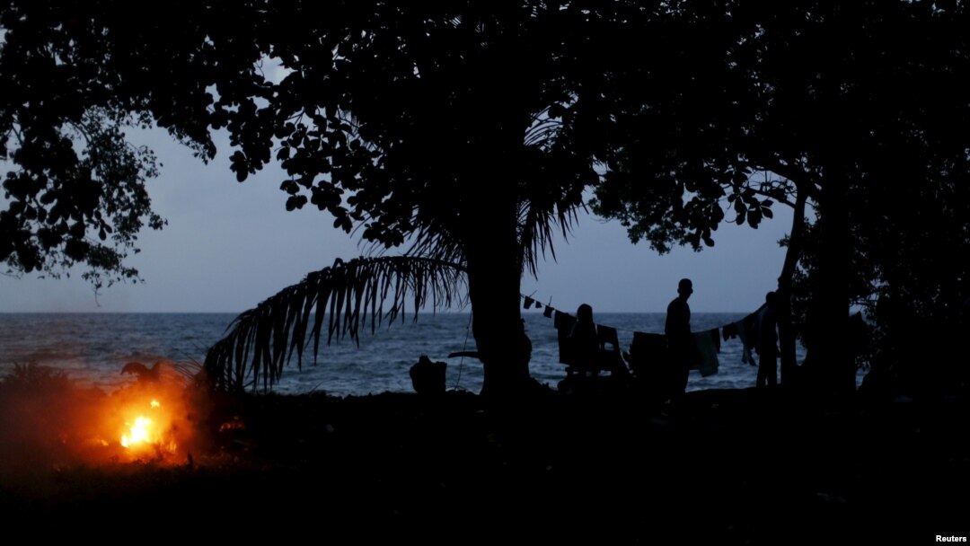 FILE - Migrants camp after crossing through the Colombian jungle on their way toward the United States, Nov. 26, 2015.