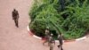 FILE - Presidential guard soldiers are seen on the grounds of the Laico Hotel in Ouagadougou, Burkina Faso, Sept. 20, 2015.