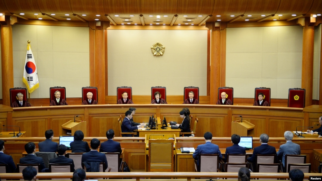 South Korean acting Constitutional Court's Chief Judge Lee Jung-mi (center) and seven judges during final ruling of President Park Geun-hye's impeachment at the Constitutional Court in Seoul, South Korea, March 10, 2017.