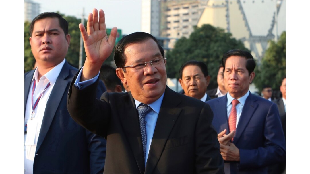 FILE - Cambodian Prime Minister Hun Sen waves to government civil servants in Phnom Penh, Cambodia, Jan. 7, 2020.