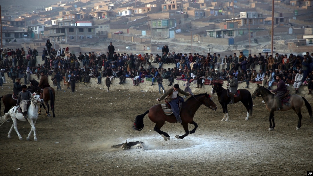 Afghan horse riders compete for the goat during a friendly buzkashi match on the outskirts of Kabul, Afghanistan.