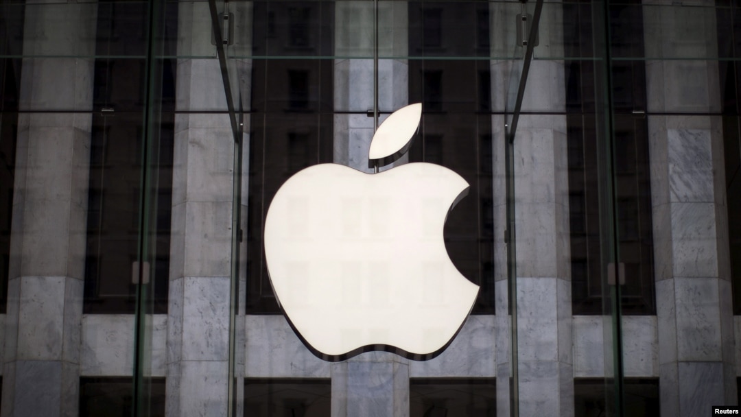 FILE - An Apple logo hangs above the entrance to the Apple store on 5th Avenue in the Manhattan borough of New York City, July 21, 2015. 