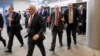 From left, Sens. Mark Pryor, D-Ark., Bob Corker, R-Tenn., James Risch, R-Idaho, John McCain, R-Ariz., and Orrin G. Hatch, R-Utah, rush to the Senate floor for a procedural vote, ahead of a midnight deadline to keep the government running, Dec. 11, 2014.
