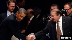 AQSh prezidenti Barak Obama Pokiston Bosh vaziri Navoz Sharif bilan yadroviy xavfsizlikka bag'ishlangan xalqaro anjumanda. Gaaga. 24-mart, 2014 