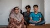 Fazel Ahmed, 9, lost his arm in a mortar attack in Afghanistan, but his family did not flee until the Taliban took over his region this summer on April 13, 2021 in Van, Turkey. (Heather Murdock/VOA)