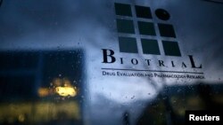 A logo is seen on a glass sign in front of the entrance of the Biotrial laboratory building in Rennes, France, Jan. 15, 2016. 