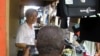 A Chinese salesman sells consumer goods in Abidjan, Ivory Coast