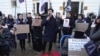 FILE - Hong Kong activist Tony Chung takes part in a protest against Hong Kong's Basic Law Article 23, in London, March 23, 2024.