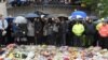 People near the scene of the recent attack observe a minute's silence in tribute to the victims of the attack at London Bridge and Borough Market, in central London, June 6, 2017. 