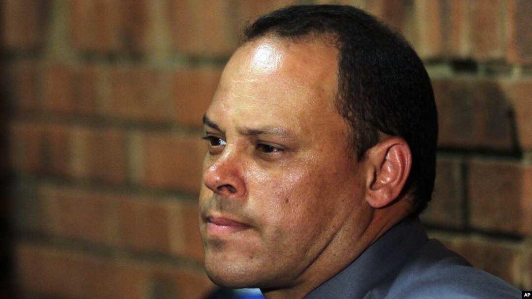 Investigating officer Hilton Botha, sits inside the court witness box during the Oscar Pistorius bail hearing at the magistrate court in Pretoria, South Africa, February 20, 2013.