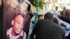 FILE - Family react during a funeral ceremony for Mario Jn Louis, a police officer killed by armed gangs in Port-au-Prince, Haiti, on Dec. 19, 2024.