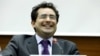 FILE - Executive director of UN Watch Hillel Neuer smiles after the presentation of a report by the Independent Commission of Inquiry on the 2014 Gaza Conflict in Geneva, June 29, 2015.
