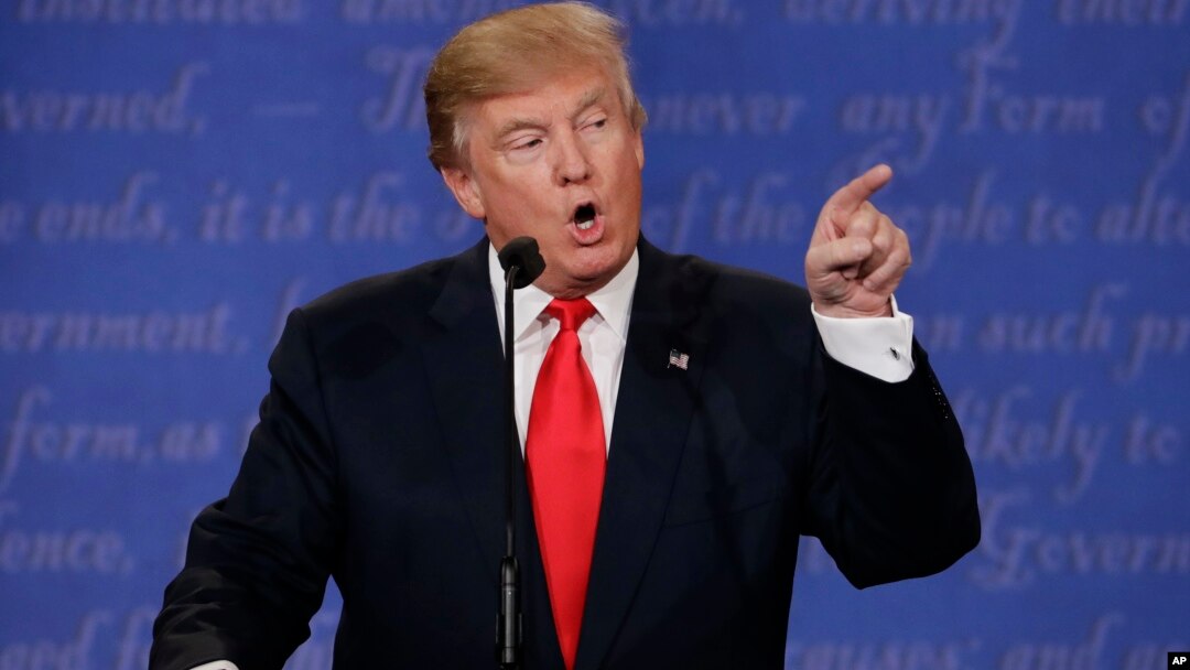 Republican presidential nominee Donald Trump speaks to Democratic presidential nominee Hillary Clinton during the third presidential debate at UNLV in Las Vegas, Oct. 19, 2016.