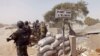 FILE - Cameroonian soldiers stand guard at a lookout post as they take part in operations against Boko Haram militants on Elbeid bridge that separates northern Cameroon form Nigeria's Borno state near the village of Fotokol, Cameroon, Feb. 25, 2015.