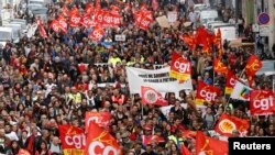 French labor union workers and students attend a demonstration against the French labor law proposal in Marseille, France, as part of a nationwide labor reform protests and strikes, March 31, 2016. 