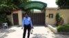 A policeman stands guard outside the Save the Children charity's office in Islamabad, Pakistan, June 12, 2015.